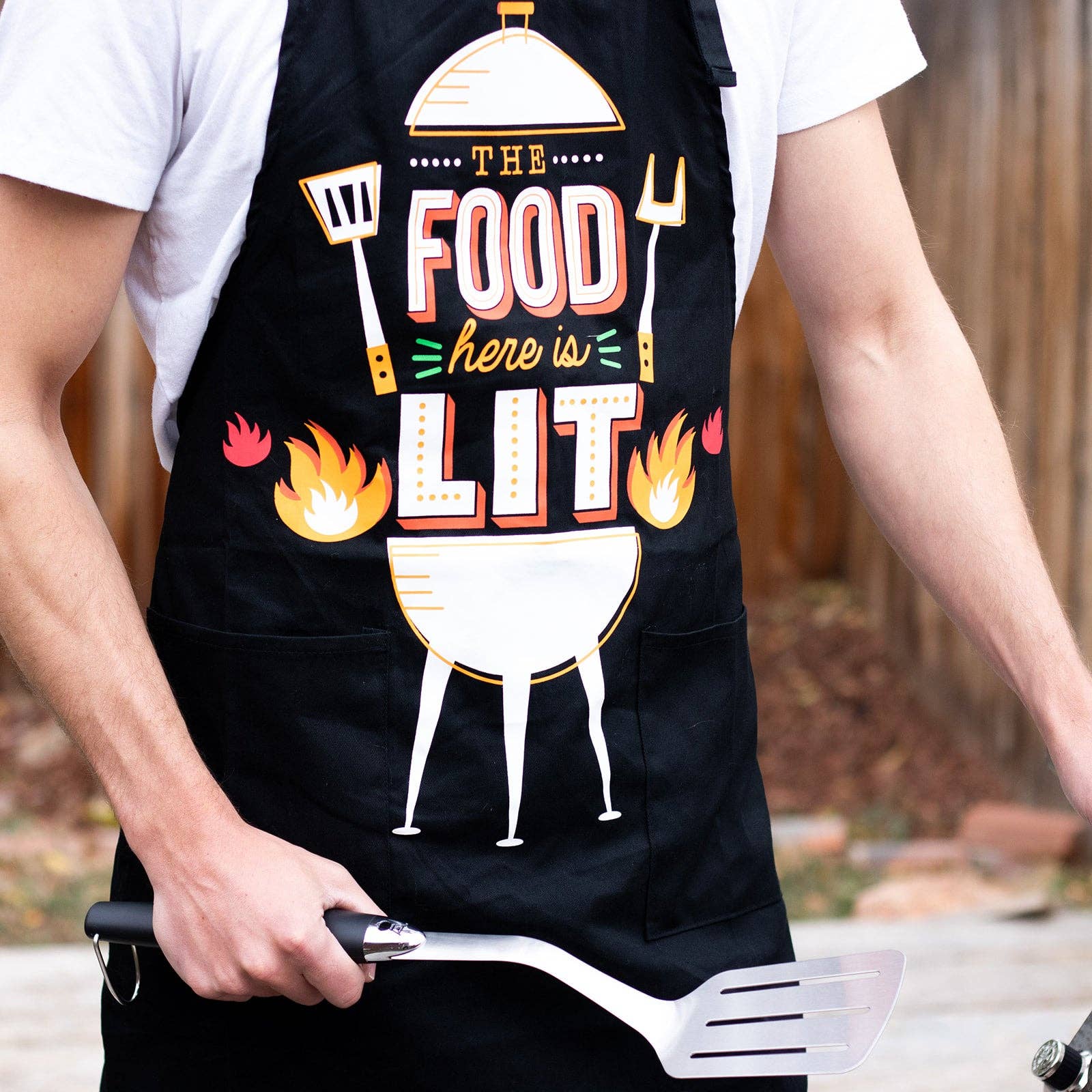 The Food Here Is Lit Apron