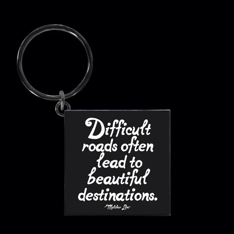 Difficult roads often lead keychain