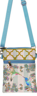 A floral-patterned crossbody bag with a blue strap and a hummingbird design.