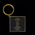 Life begins at the end of your comfort zone keychain